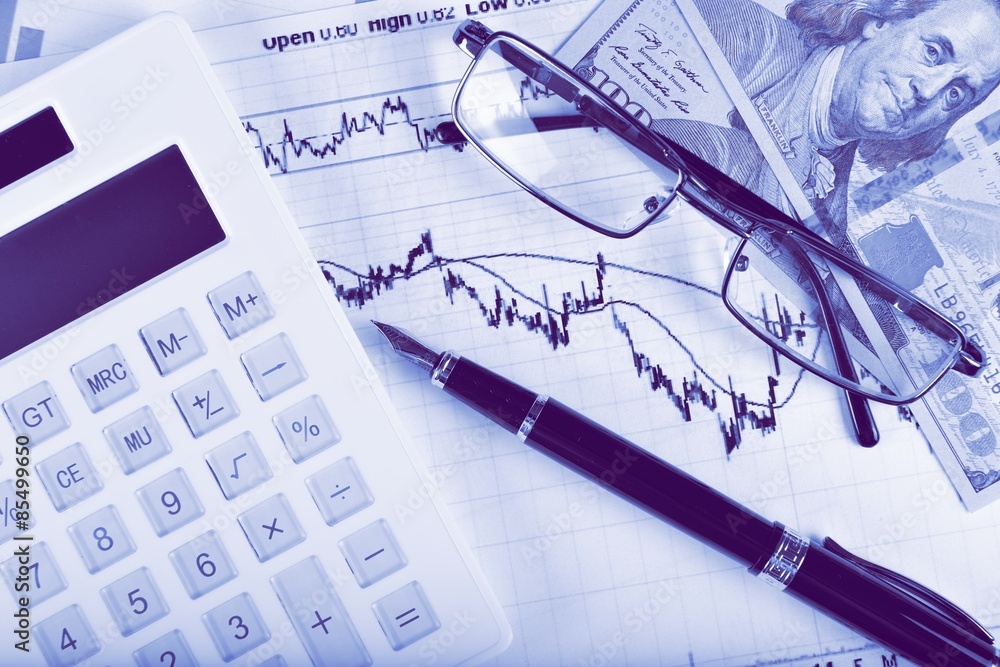 Business concept with calculator, glasses, money and documents