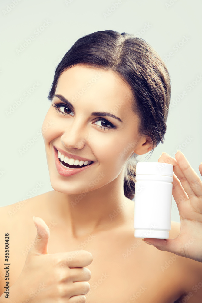 Smiling woman showing medical drug Smiling woman showing medical drug