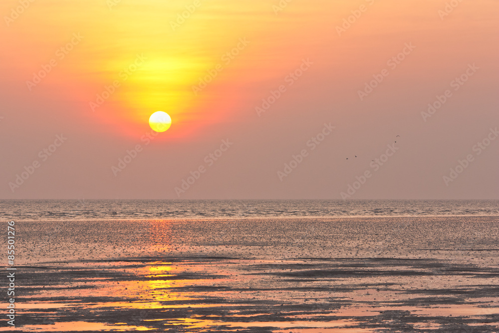 Sunset / sunrise over a beach