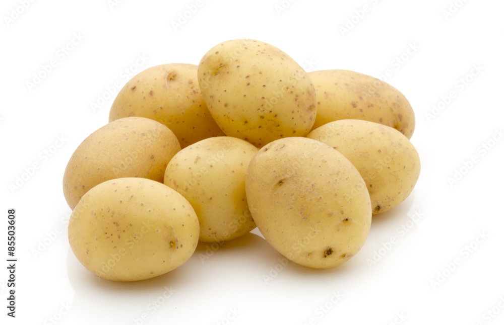 Potatoes on the white background. New harvest. Potatoes on the white background. New harvest.