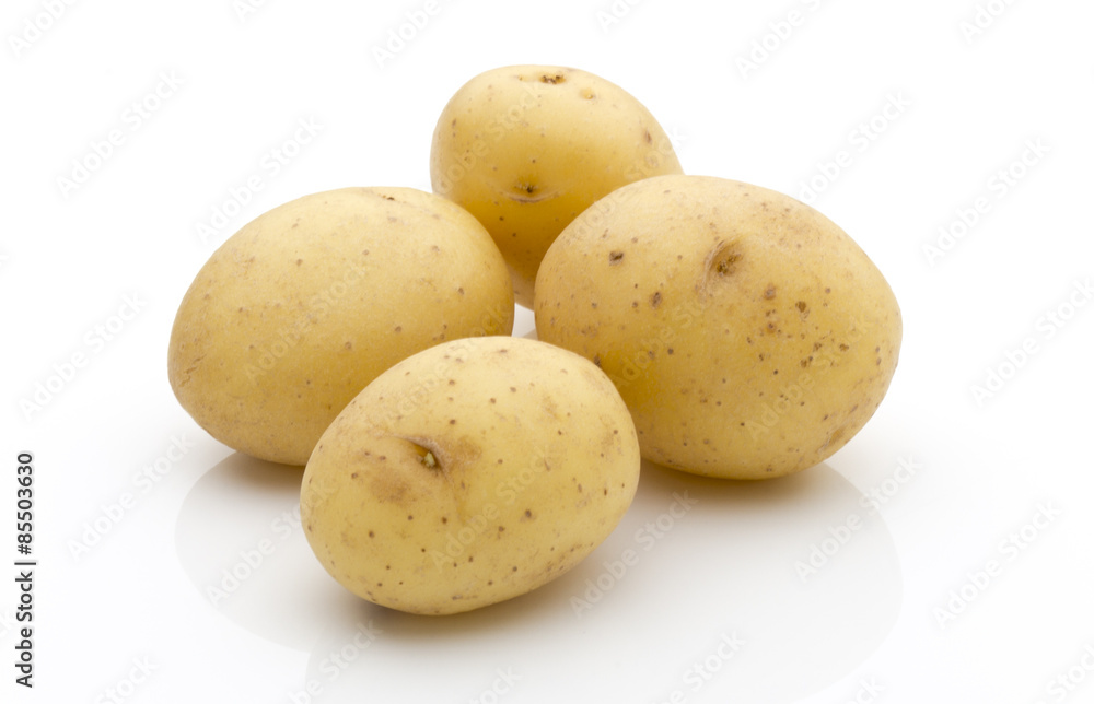 Potatoes on the white background. New harvest. Potatoes on the white background. New harvest.