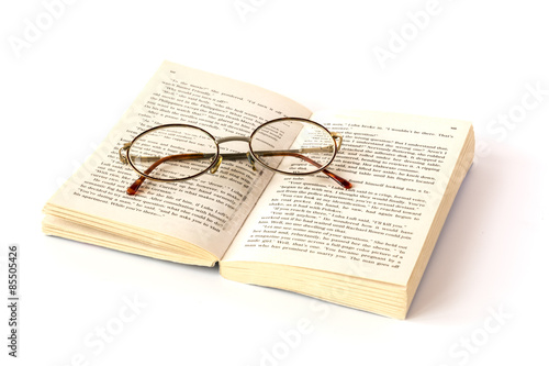Open book with reading glasses