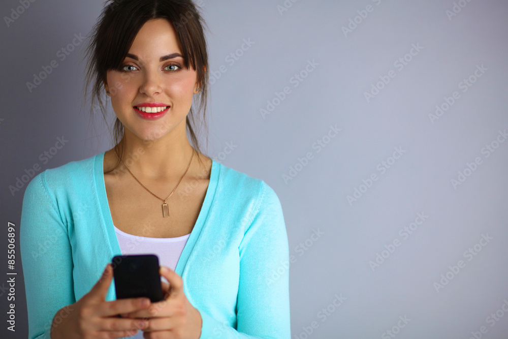 Woman using and reading a smart phone Woman using and reading a smart phone