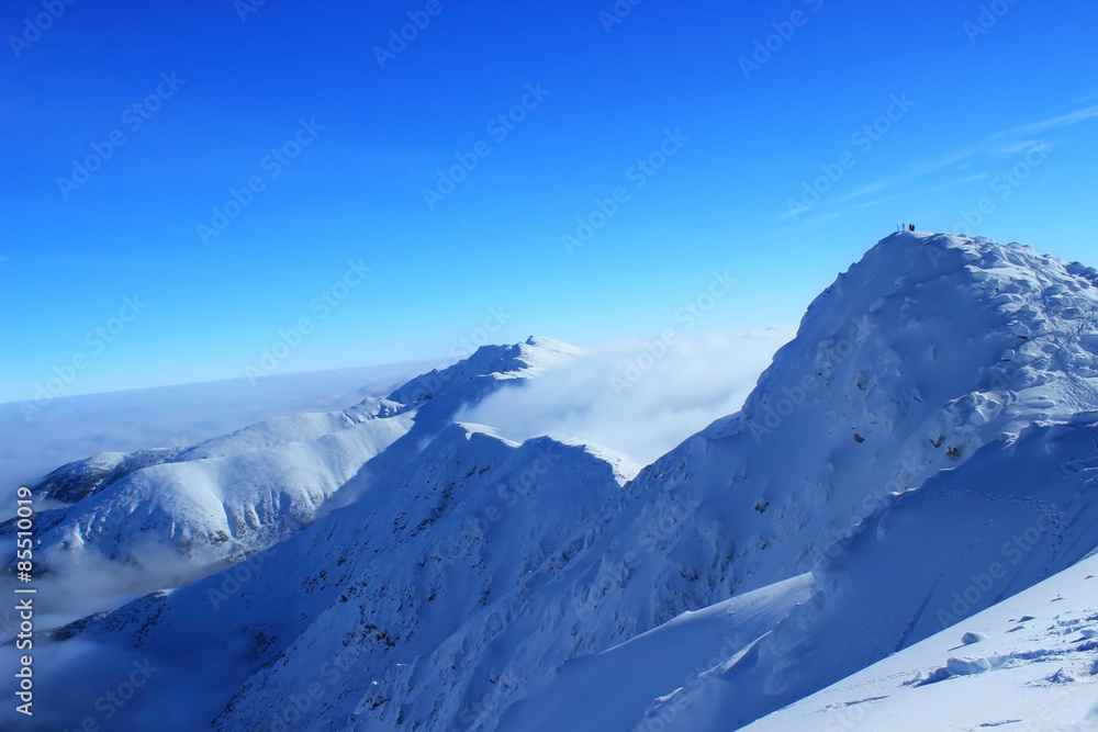 Beautiful snow-capped mountains against the blue sky