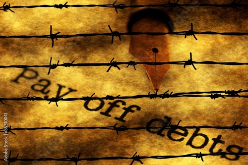 Pay of debts text against barbwire