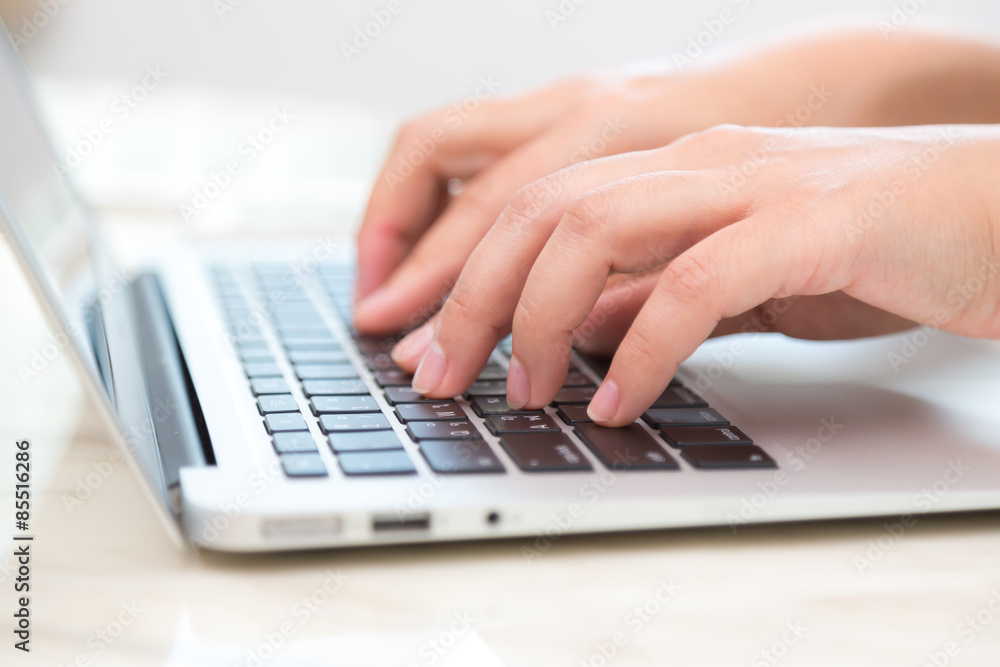 Closeup of business woman hand typing on laptop keyboard Closeup of business woman hand typing on laptop keyboard