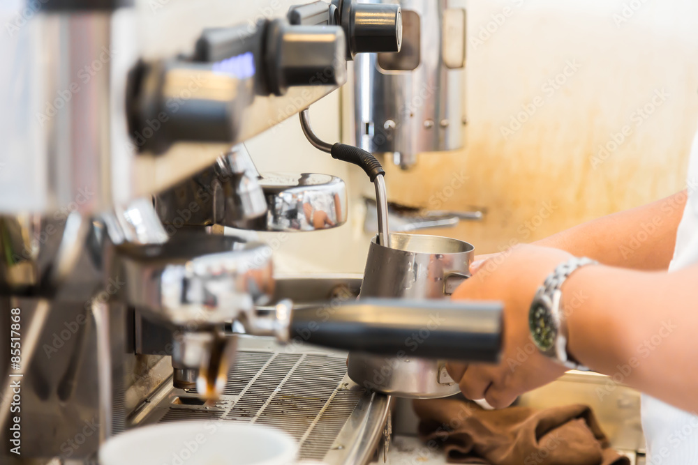 Fototapeta premium Prepares espresso in coffee shop
