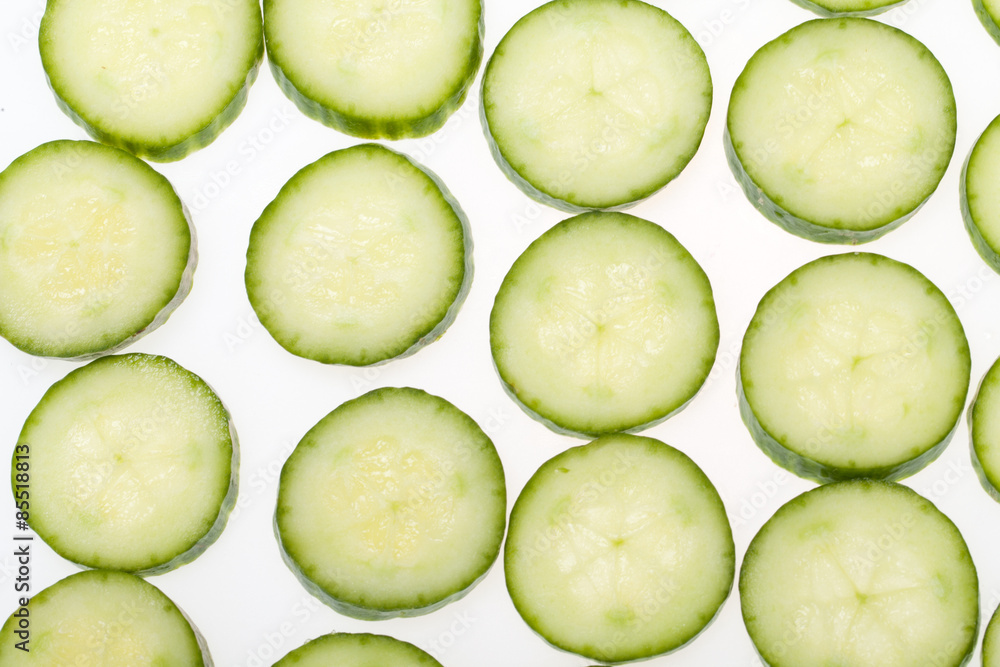 Freshly sliced cucumber isolated on white background Freshly sliced cucumber isolated on white background