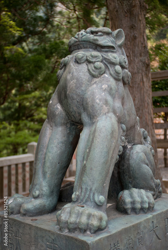 Komainu statue at a temple In Tokyo, Japan © discoverjapan