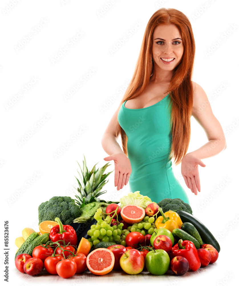 Young woman with variety of organic vegetables and fruits Young woman with variety of organic vegetables and fruits