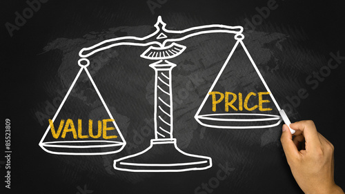 value price concept on balance scale photo