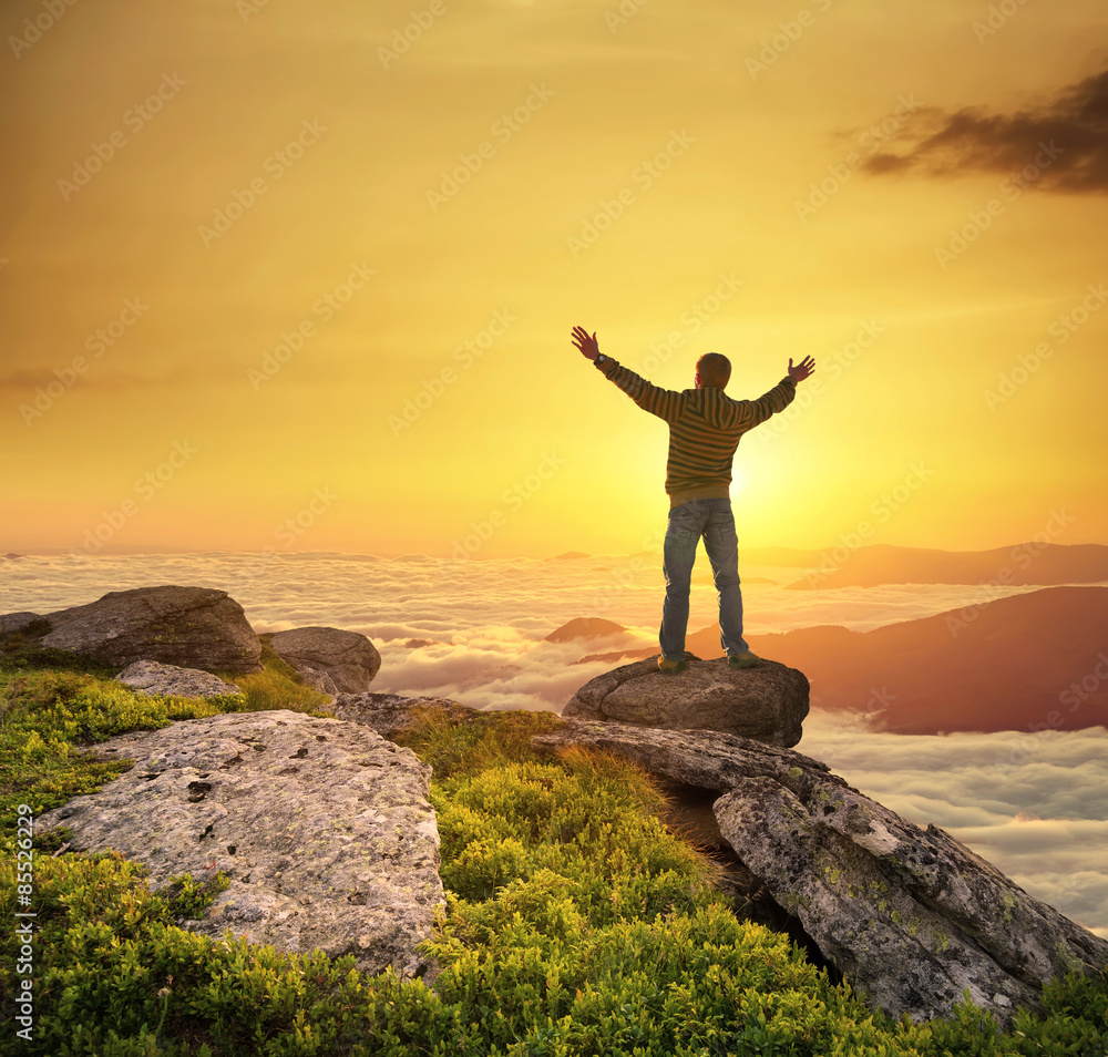 Silhouette of a champion on mountain peak. Active life concept.. Silhouette of a champion on mountain peak. Active life concept..
