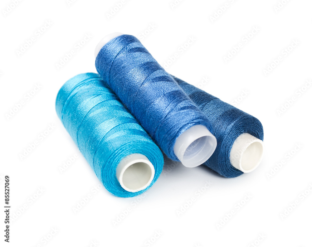 Three bobbins of thread blue color Three bobbins of thread blue color