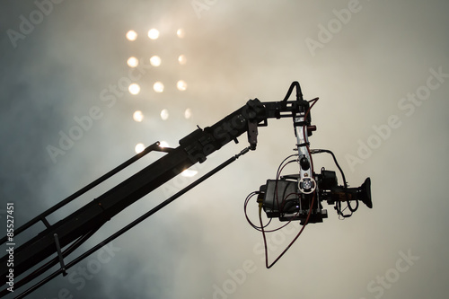 Foto TV camera on a crane on football mach or concert