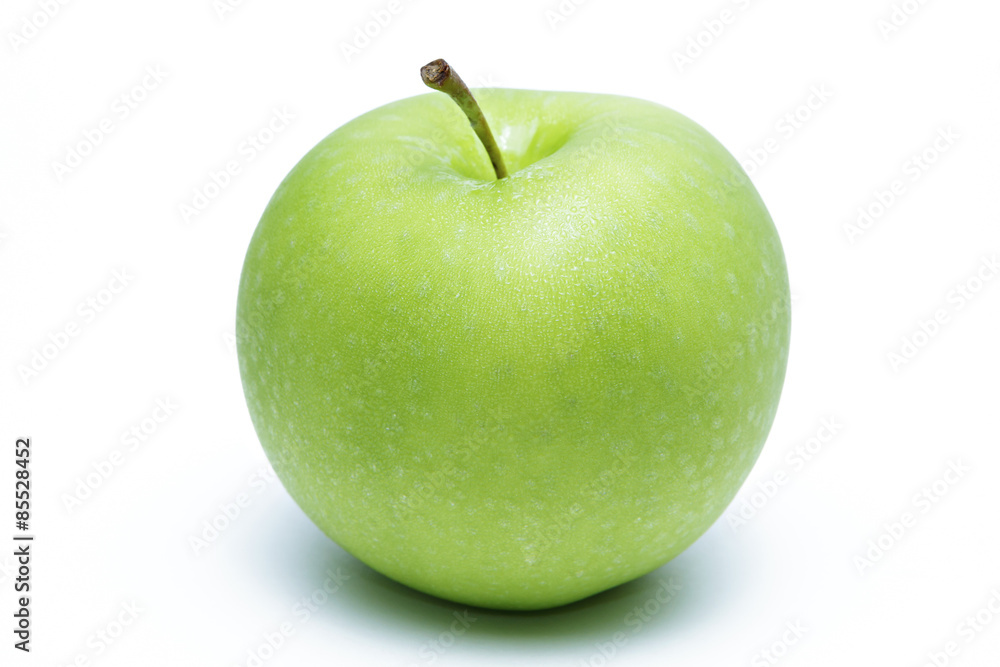 Green apple with dew  on white background