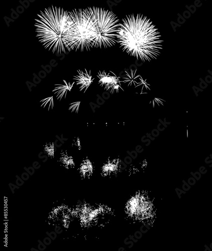 Colorful fireworks with reflection on lake.