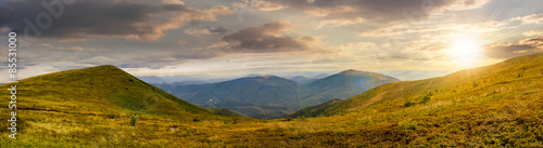 panorama of hillside with stones in high mountains at sunset