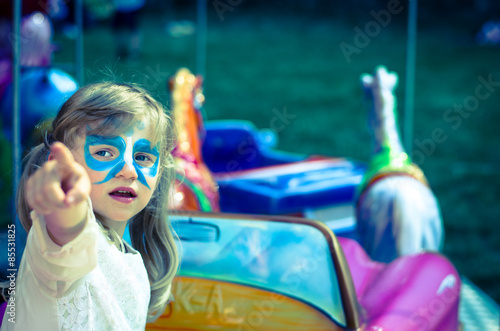 girl in marry-go-round in funland photo