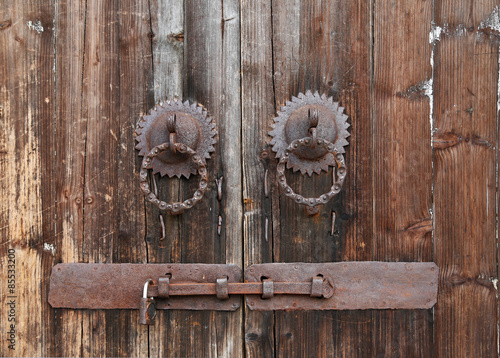 Obraz na plátně Old rusty door rings on a Wood Door