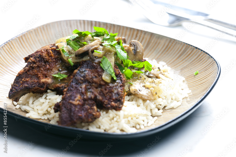 fried livres with mushroom sauce and rice