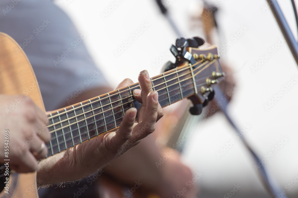 playing guitar on stage