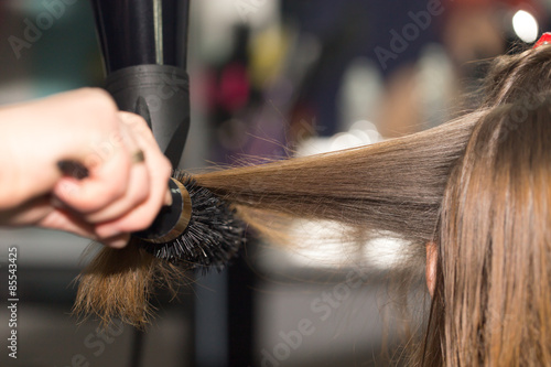 styling hair dryer in a beauty salon