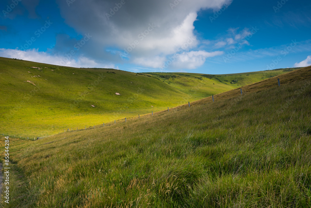 Rolling hills with blue sky with clouds