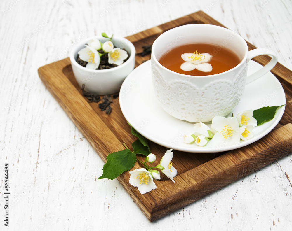 Cup of tea with jasmine flowers Cup of tea with jasmine flowers