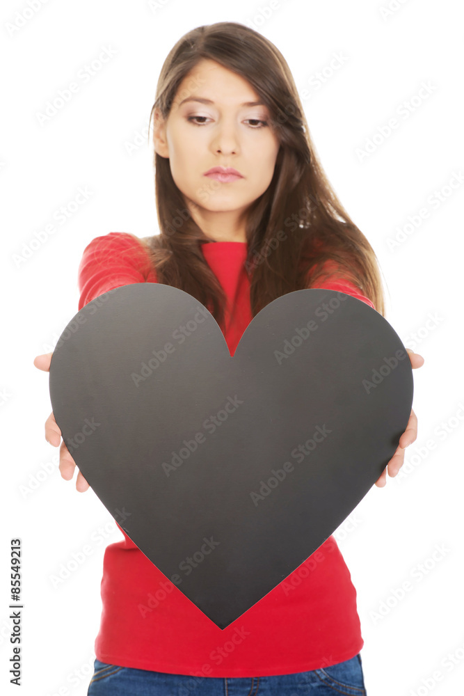 Young woman with heart made from paper. Young woman with heart made from paper.
