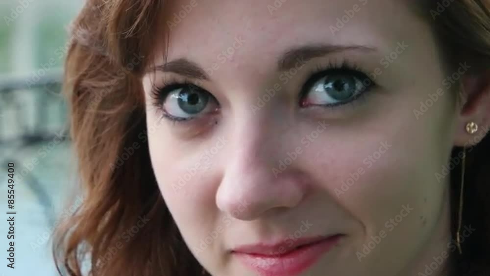 Extreme closeup of a young unadorned woman looking at camera Extreme closeup of a young unadorned woman looking at camera