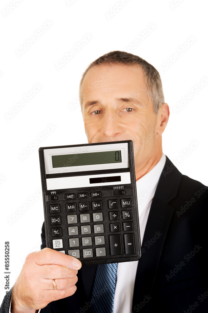 Happy businessman holding a calculator Happy businessman holding a calculator