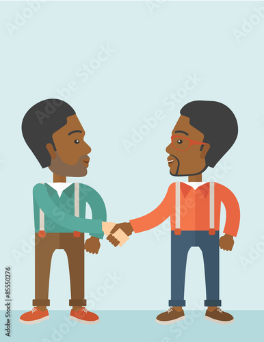 Two African-american guys happily handshaking.