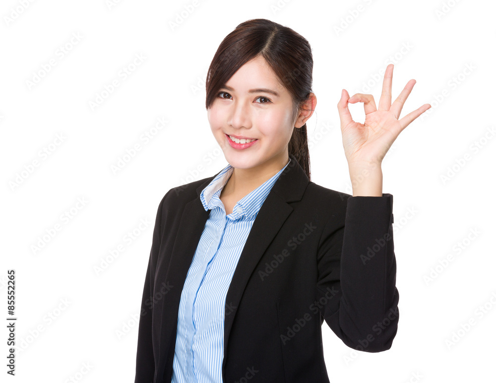 Young businesswoman with ok sign gesture Young businesswoman with ok sign gesture