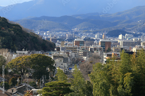 Kyoto, Japan - city in the region of Kansai. Aerial view with sk © rufous