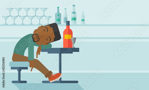 African Drunk man fall asleep in the pub.