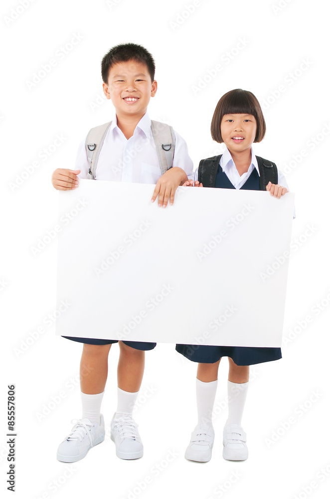 Asian primary school students holding white board Asian primary school students holding white board