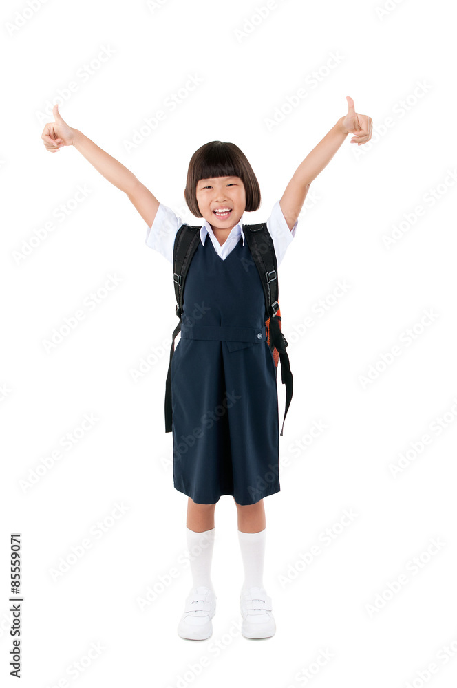 Asian primary school student raised her thumbs up Asian primary school student raised her thumbs up