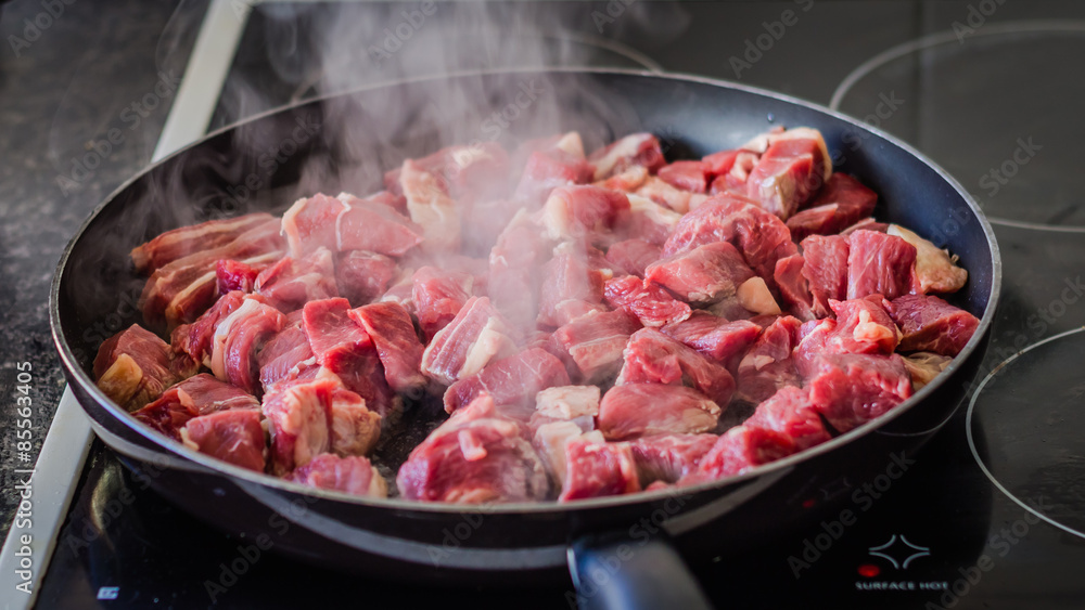 Frying beef on pan Frying beef on pan