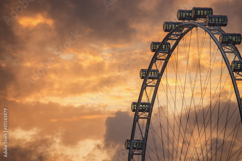 Ferris Wheel on the background of evening sky