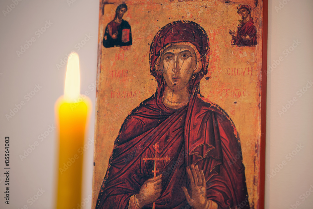 Fototapeta premium Candle light for religious celebration/Picture of Saint