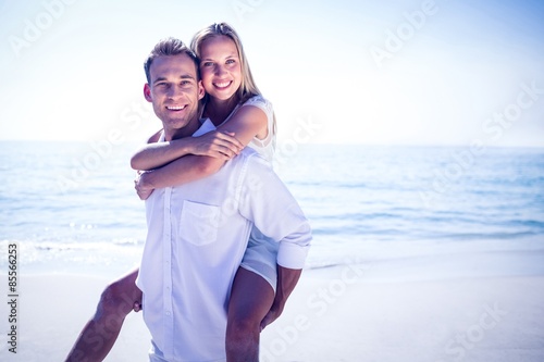  Happy couple having fun on the beach