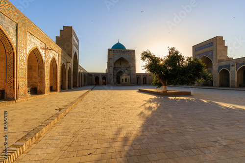 View of Kolon mosque at sunset, Bukhara, Uzbekistan. photo