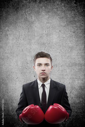 Businessman boxer standing in front of the wall © 4Max