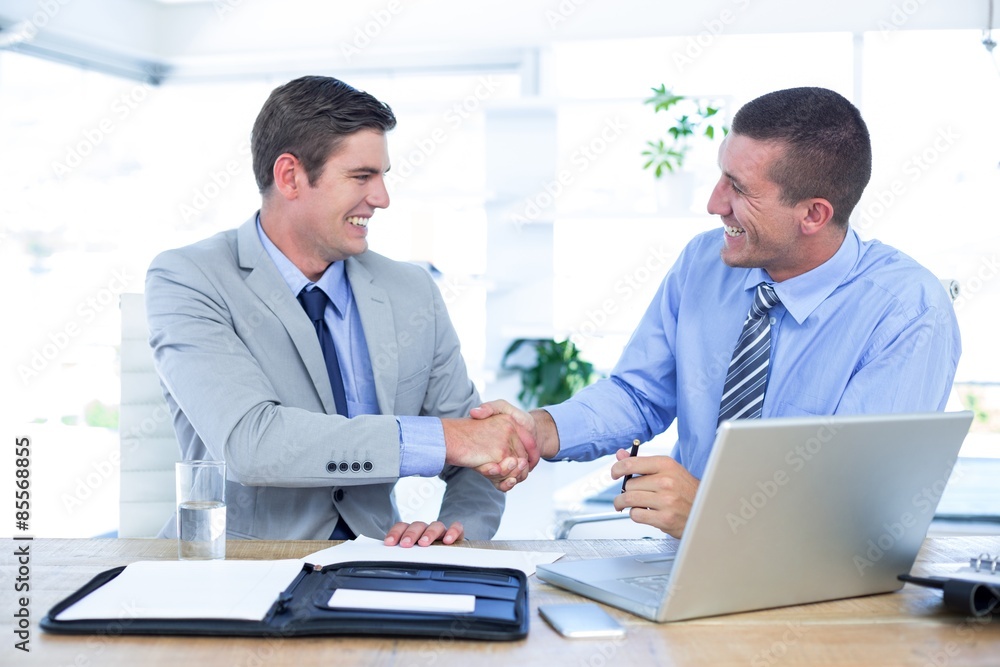 Business partners shaking hands Business partners shaking hands