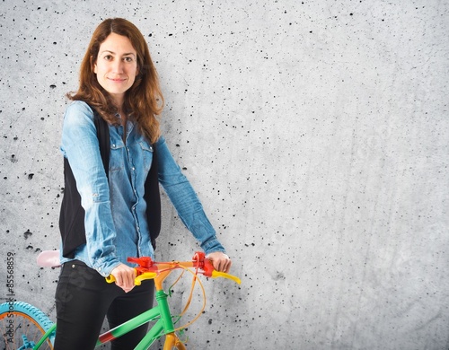 Woman with her colorful bicycle
