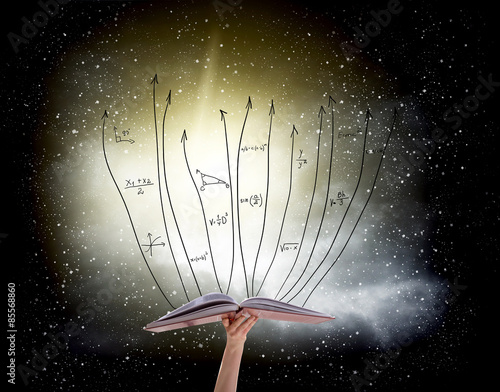 Obraz na płótnie Human hand holding book with flying math formulas