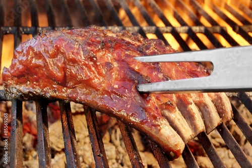 Billede på lærred Pork Spare Ribs On The Hot Flaming  Barbecue Grill