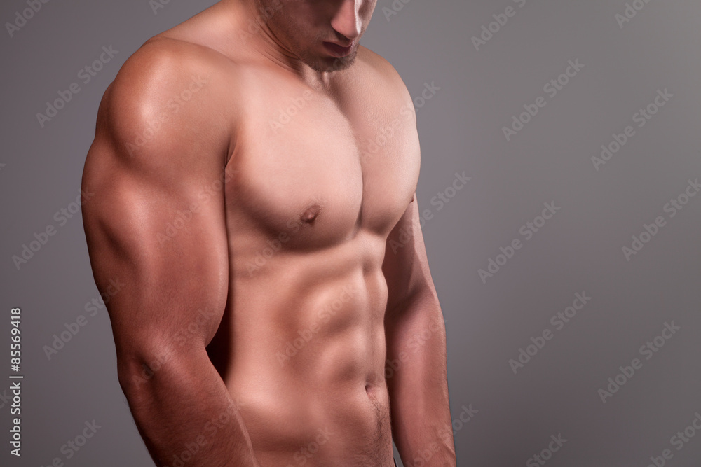 Muscular man with naked chest posing in studio Muscular man with naked chest posing in studio