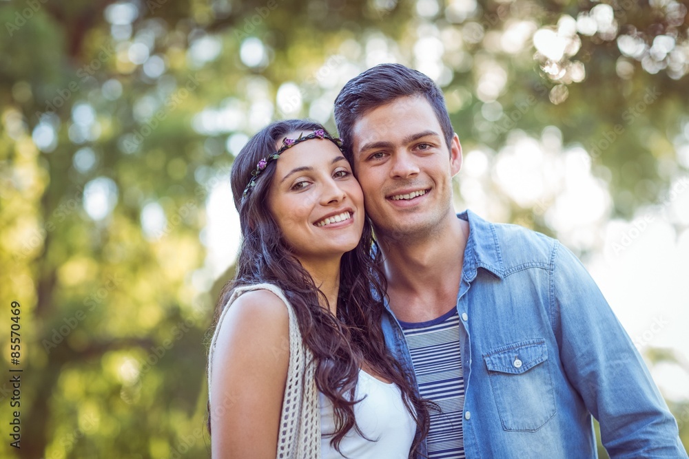 Fototapeta premium Cute couple smiling in the park