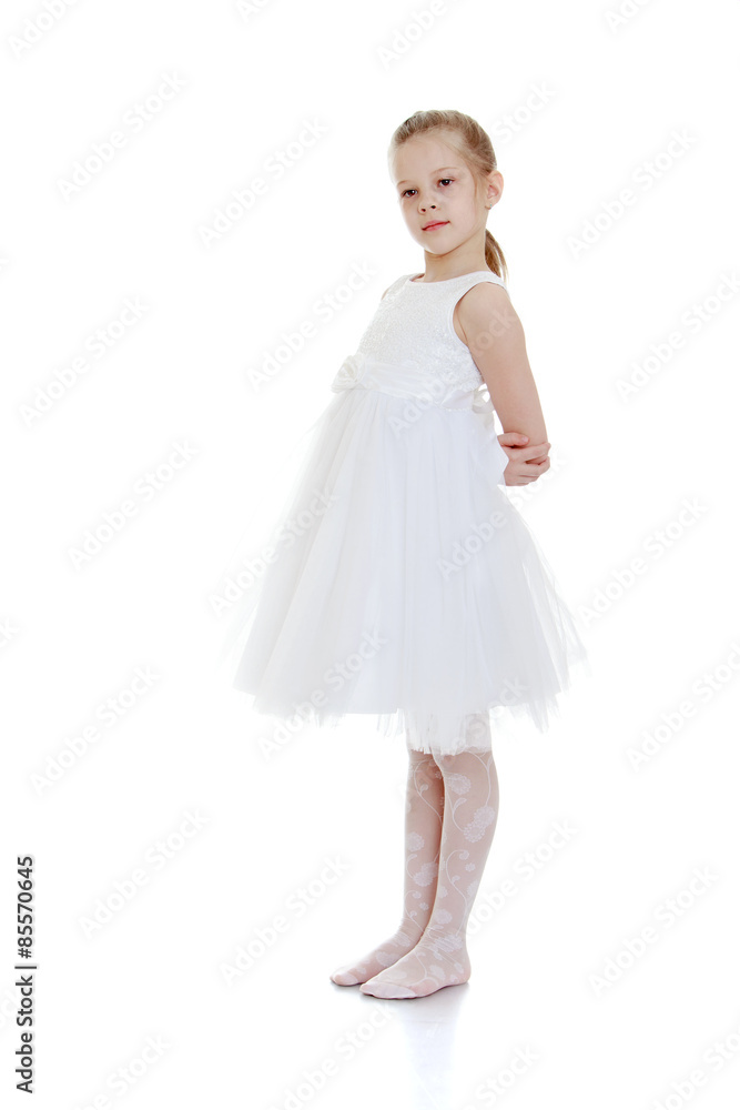 Beautiful ballerina girl in white dress